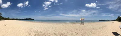panorama with white sand, blue sky and the ocean on Ko Lanta, Thailand