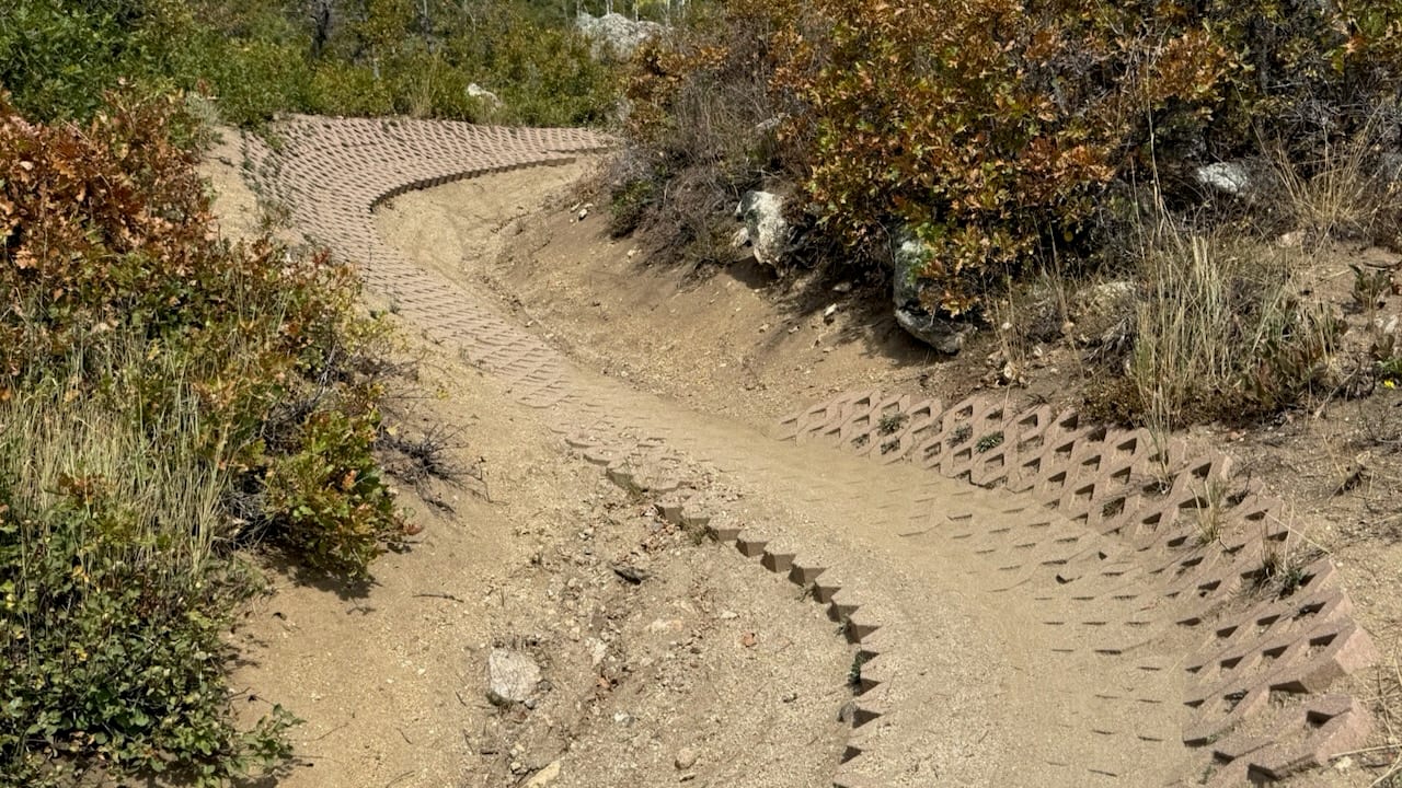 A paved berm on a flow trail at the Steamboat bike park