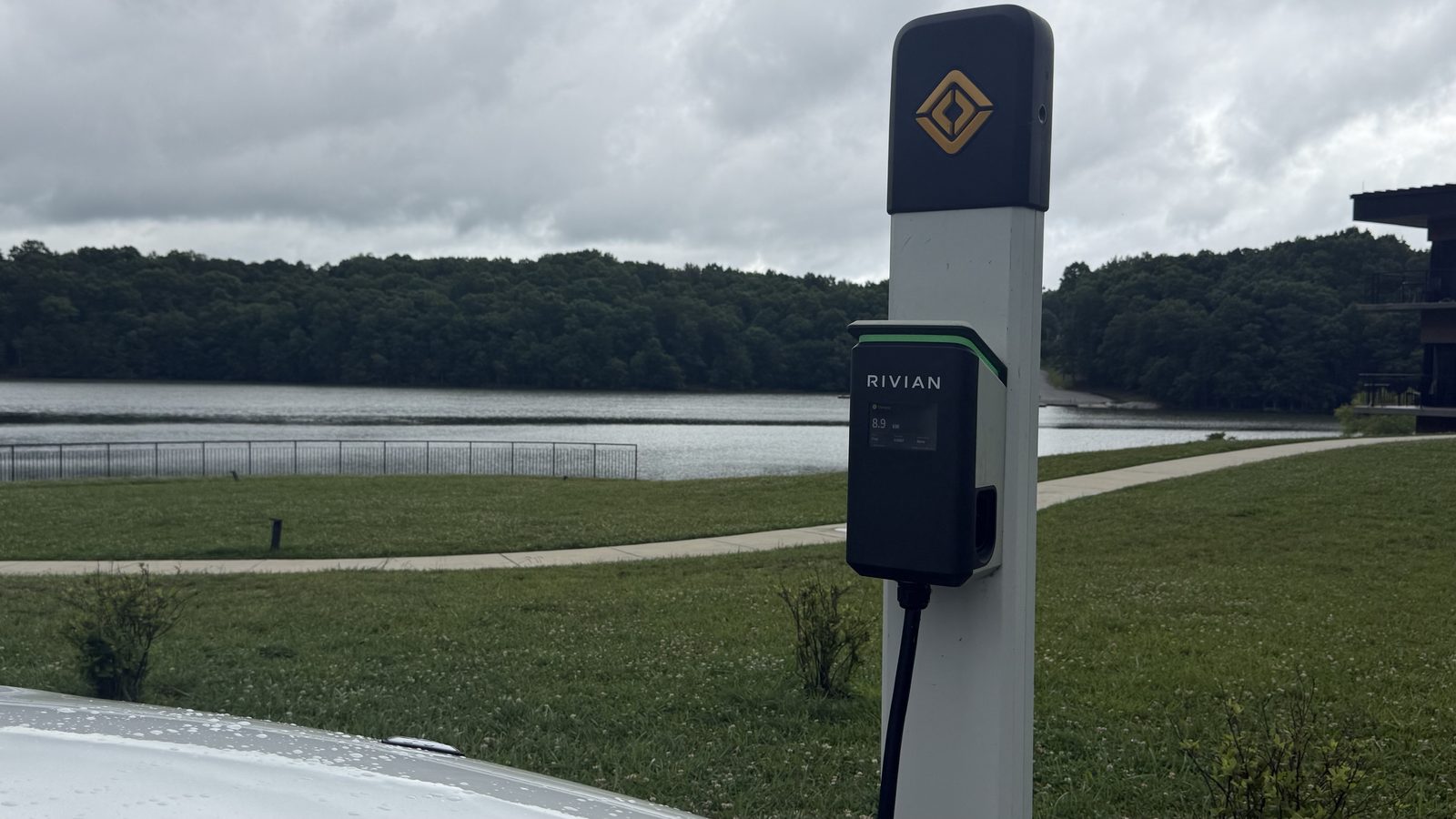 A Rivian Waypoint charger by the lake at Fall Creek Falls State Park, showing 8.9 kW