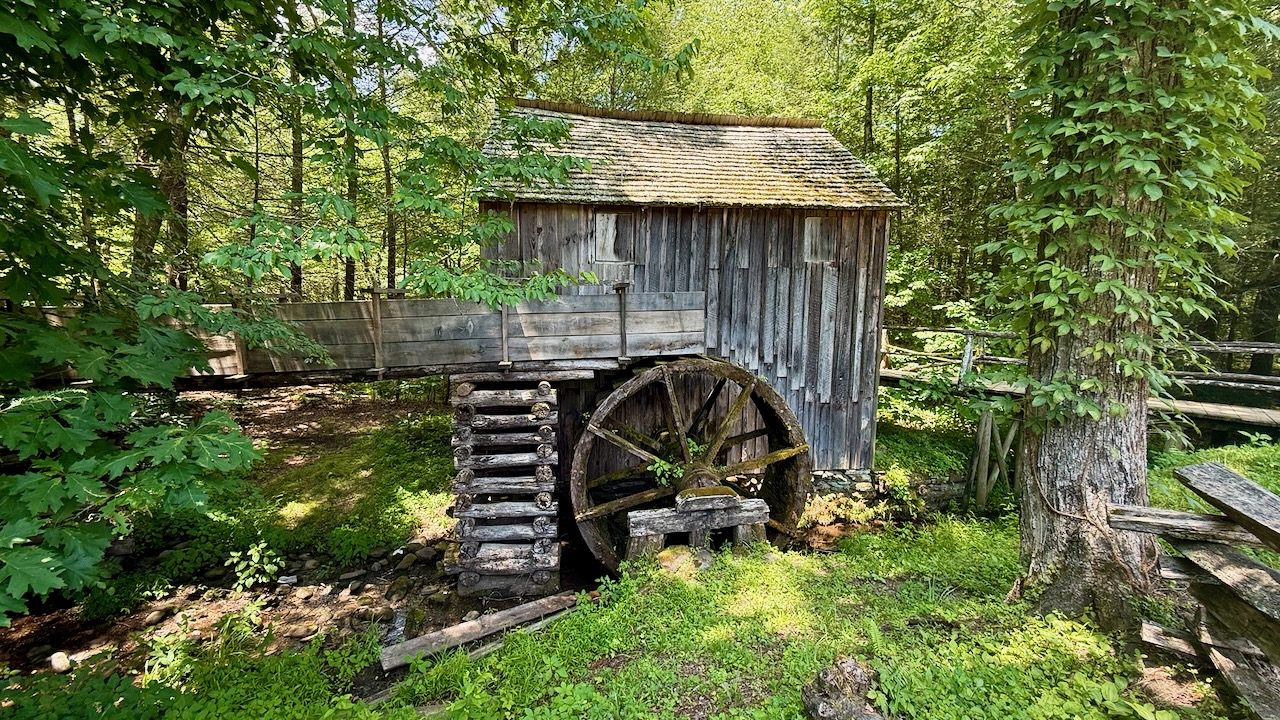 An old grist mill with a water wheel in Cades Cove