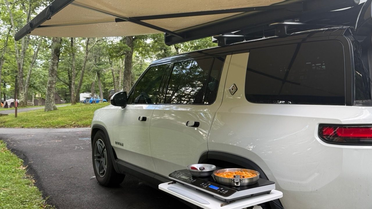 The Rivian with its awning out and a camp stove set up at Big Meadows Campground, Shenandoah